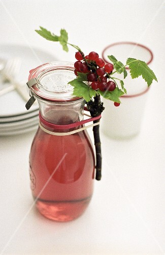 Home-made redcurrant vinegar in carafe