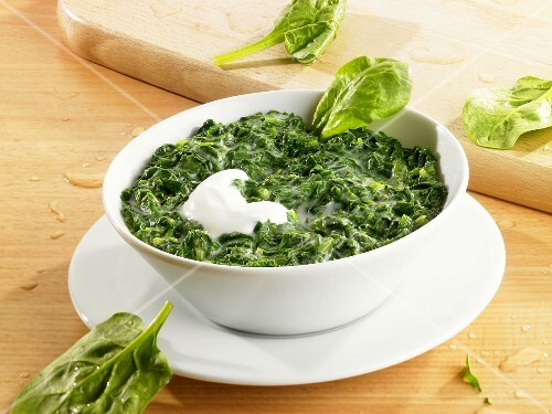 Creamed spinach with a spoonful of sour cream