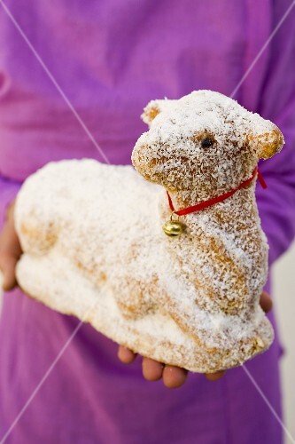 Hands holding sweet Easter lamb