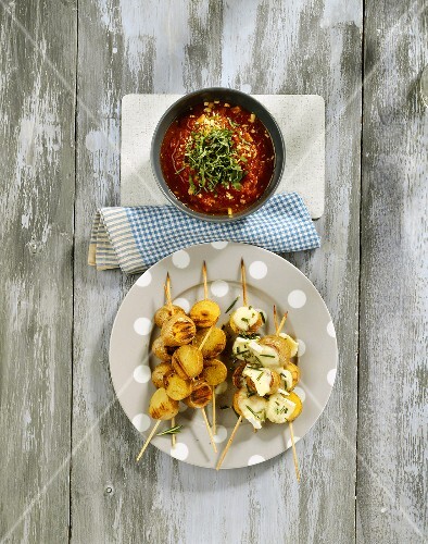 Potato kebabs with Brie and tomato dip