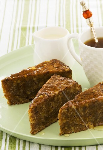 Pieces of walnut cake with maple syrup