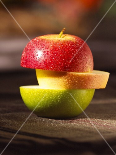 An apple sliced in three