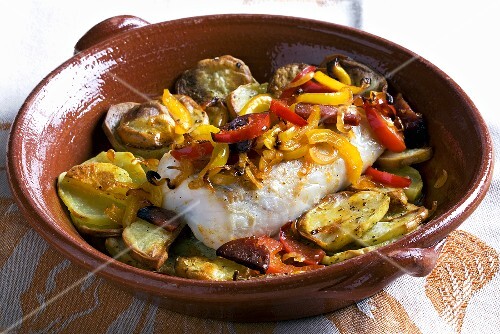 Fish fillet with potatoes, pepper and chorizo (Spain)