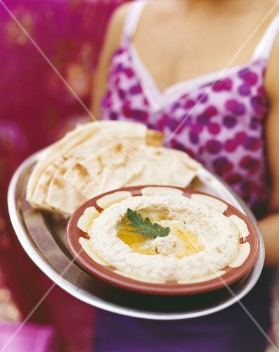 Hummus in dish with flatbread