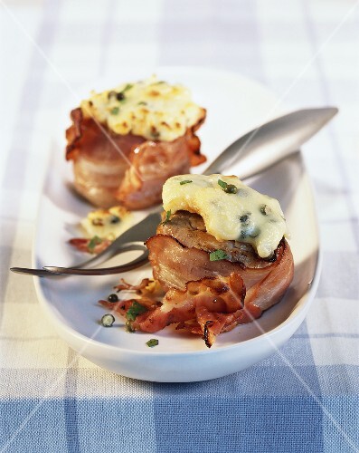 Slices of pork fillet with cheese topping