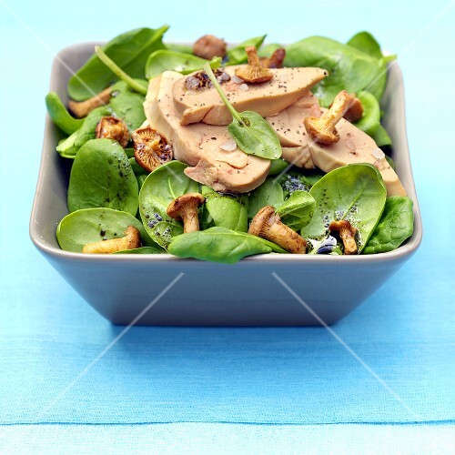Spinach salad with goose foie gras and chanterelles