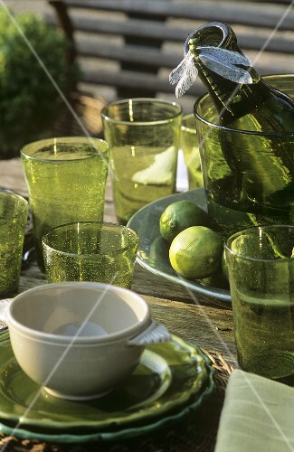Glasses and wine on laid table out of doors