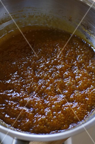 Caramel cooking in a sauteuse