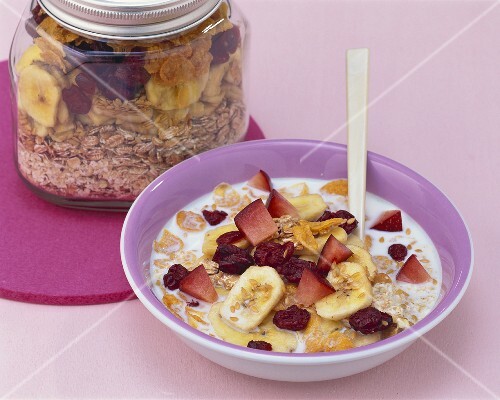 Muesli with banana chips, cranberries and fresh fruit