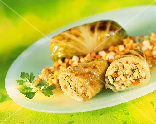 Cabbage leaves stuffed with pearl barley and carrots
