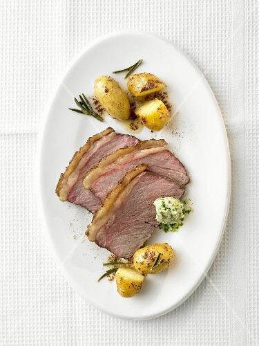 Rump steak with herb butter and rosemary potatoes
