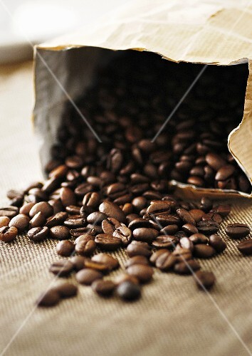 Partially spilt bag of coffee beans