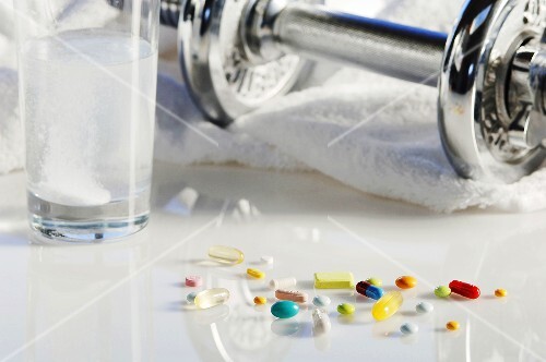 Pills, effervescent tablet and dumbbell