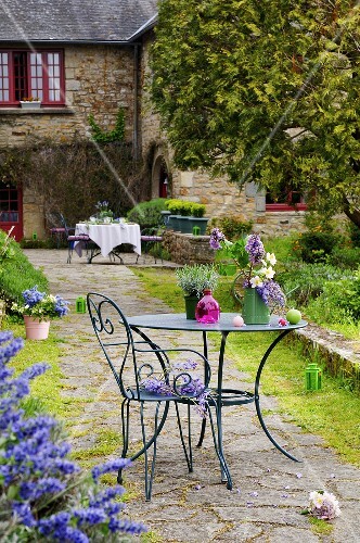 Flowers on garden table and chair