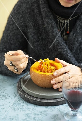 Woman eating spaghetti squash with saffron