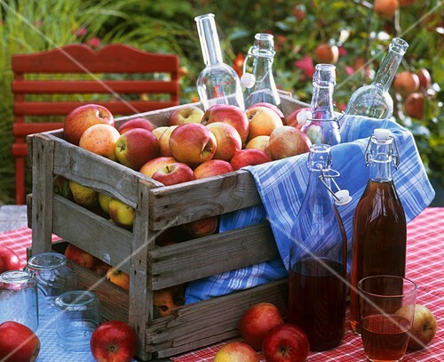 Crate of apples and bottles of juice