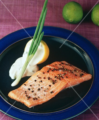 A fillet of salmon with peppercorns and lemon sauce