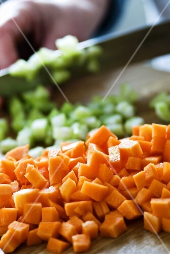 Carrots and celery being diced
