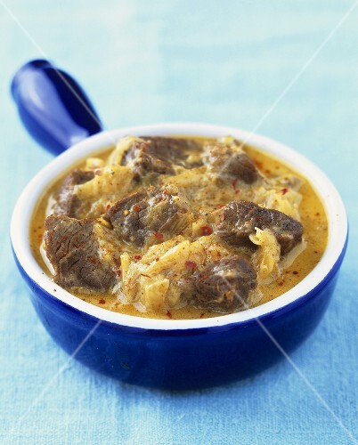 Beef goulash with cabbage in a pan
