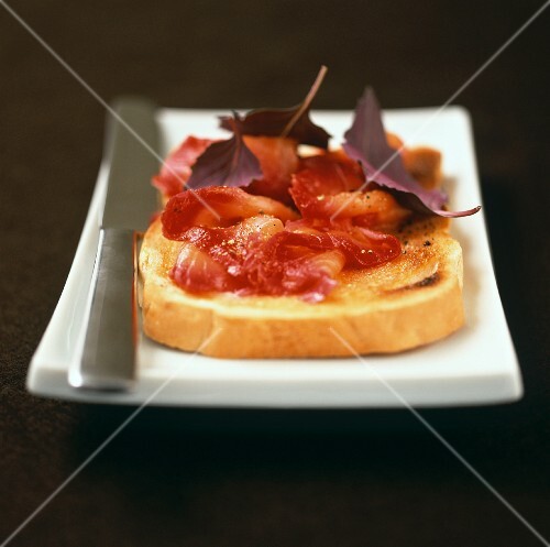 Beetroot juice-marinated smoked salmon on a slice of toast