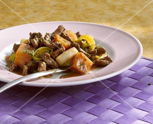 Pieces of ostrich meat with sweet potatoes and leeks