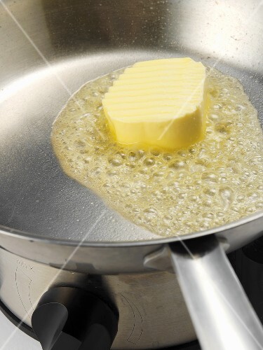 Melting butter in a frying pan
