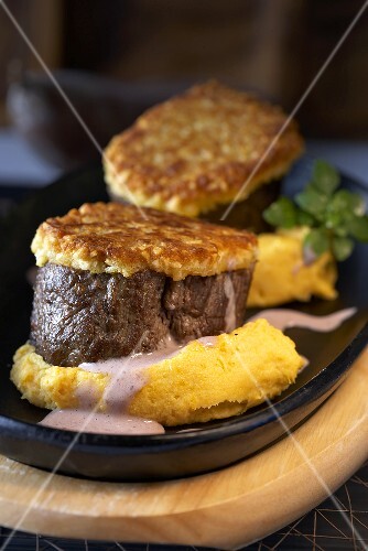 Ostrich medallions with rösti and polenta