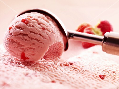 Strawberry ice cream with ice cream scoop