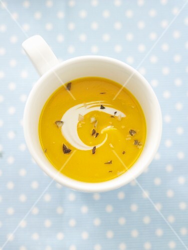Pumpkin soup in cup from above