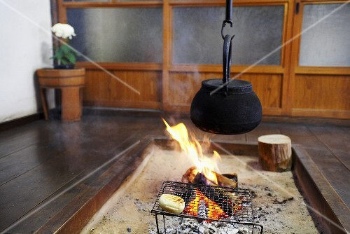 Irori (Japanese sunken hearth with sandy floor for cooking &heating)