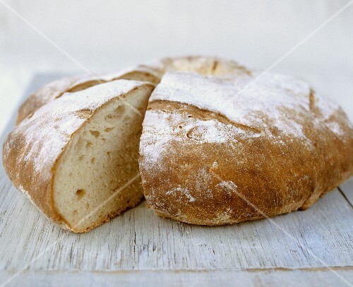 Round white loaf, a wedge cut