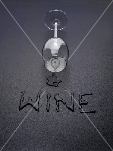 An upset white wine glass with the word 'Wine'