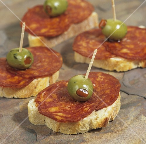 Canapés with organic chorizo and stuffed olives