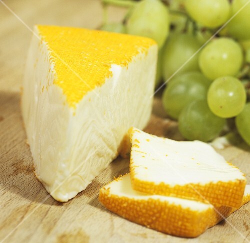 Port Salut cheese with grapes