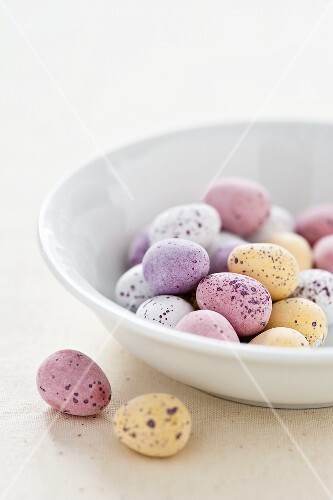 Chocolate eggs with pastel colored sugar glaze