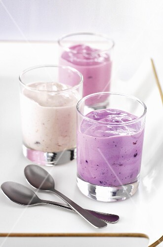 Three yogurts in glasses