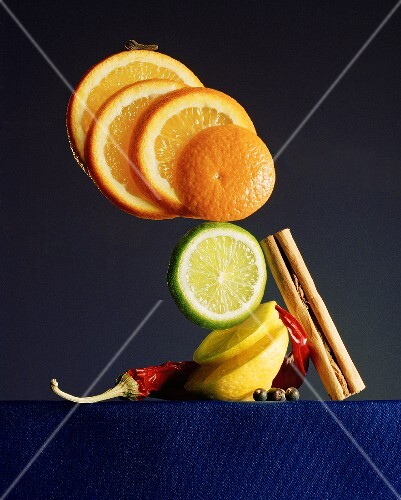 Citrus fruits in slices and various spices