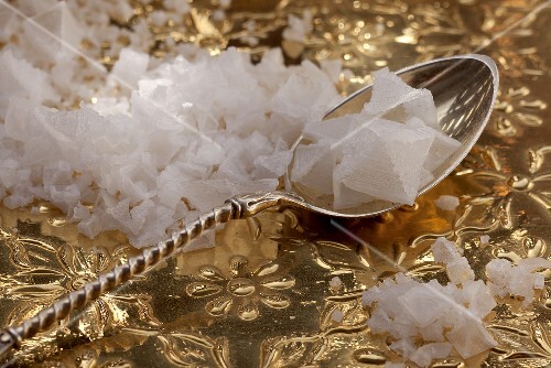 Fleur de sel and a spoon in a silver dish