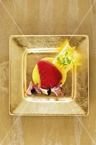 Marinated tuna with olive cream and squid