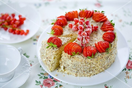 A strawberry and redcurrant cake, sliced