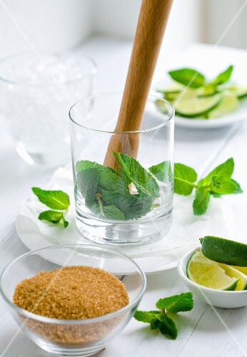 Ingredients for mojito (brown sugar, limes, mint)