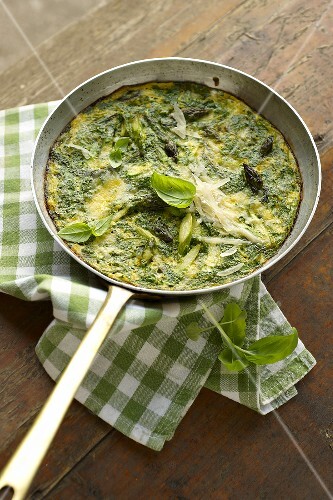 An egg pancakes with herbs and asparagus