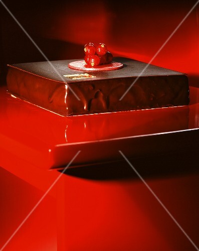 Chocolate cake decorated with red currants