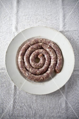 Detail of a coiled Toulouse sausage, one of the staple ingredients of cassoulet