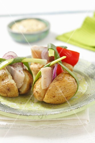 New potatoes filled with herring, pepper and onions