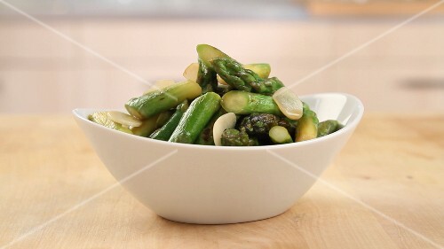 Green asparagus being prepared in a pan (English Voice Over)