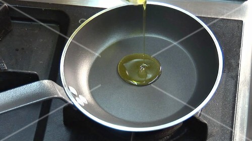 Frying an egg in a little oil in a frying pan