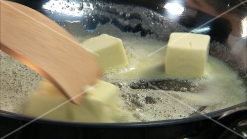 Melting butter in a frying pan