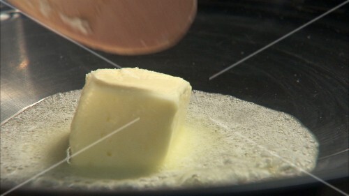 Melting butter in a frying pan