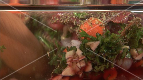Making Boeuf Bourguignon: beef in red wine marinade